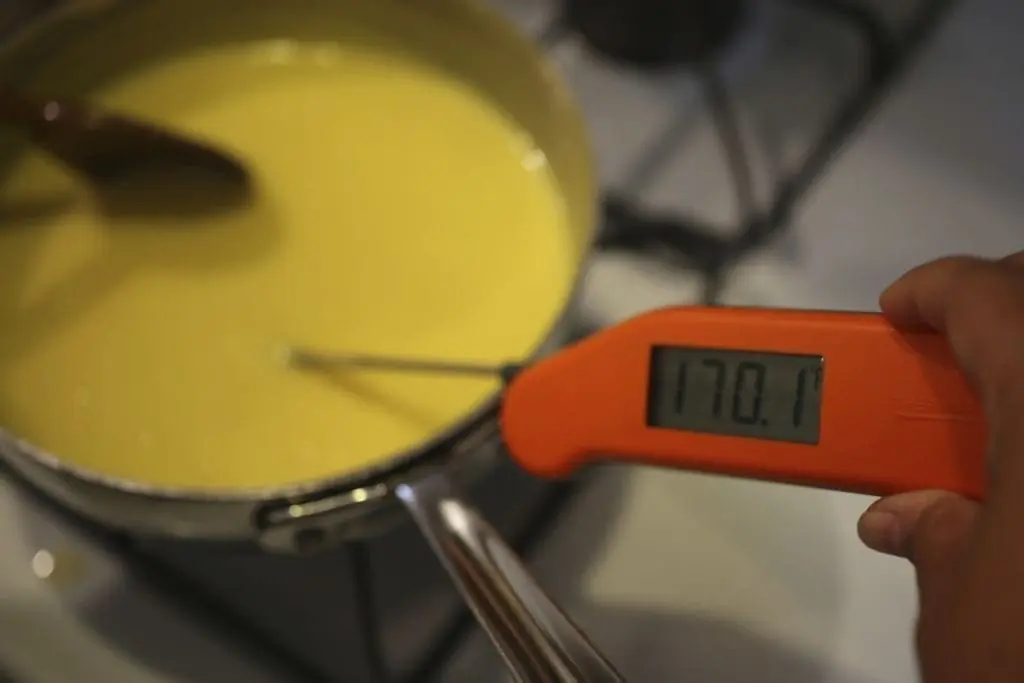 Testing temperature of lemon curd