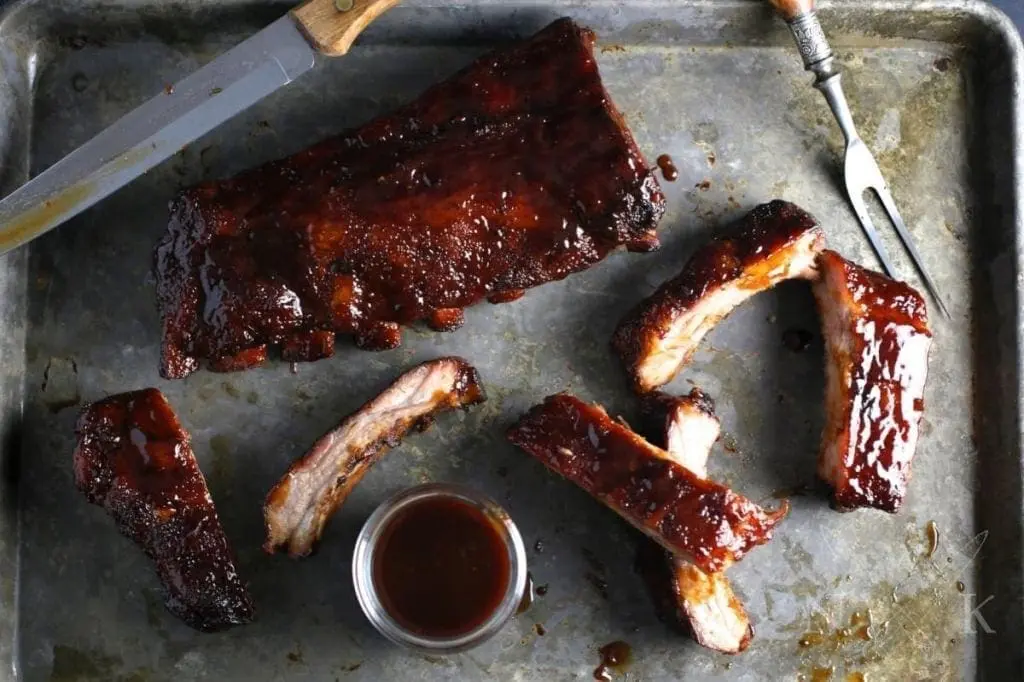 A tray with glazed ribs on it