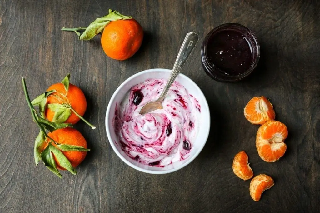 Yogurt with grape jelly and Oranges