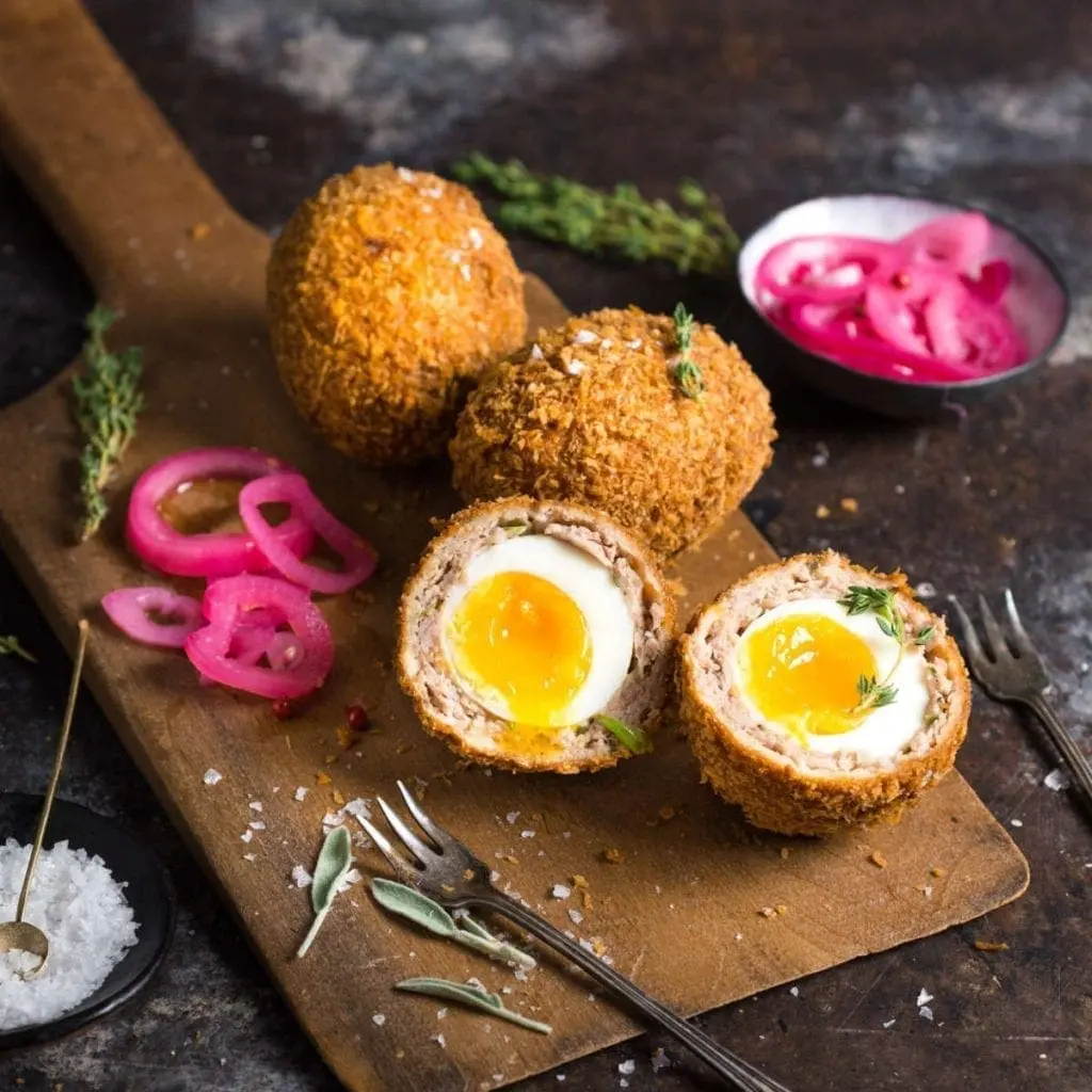 A platter of Scotch Eggs with runny Yolks