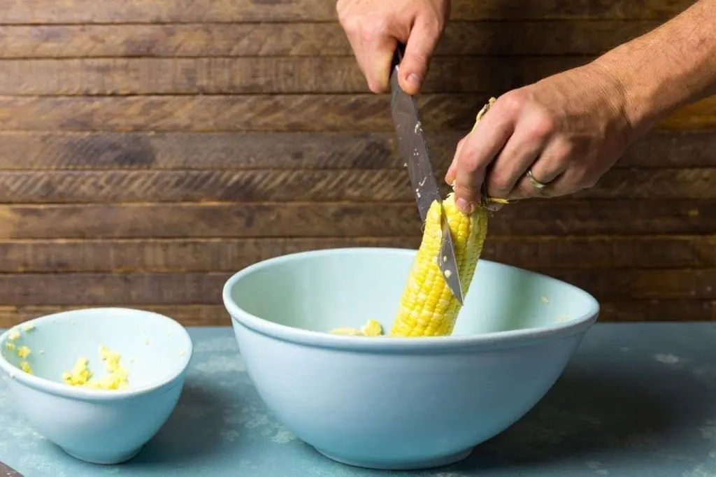 Cutting corn off the cob