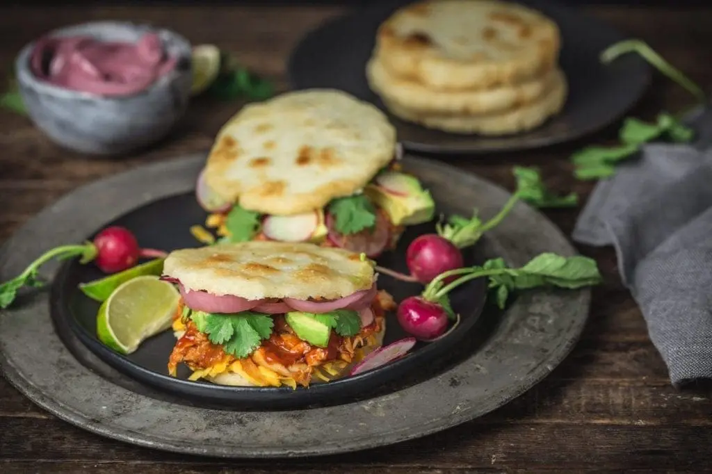 Arepas with Pulled BBQ Chicken, Cheddar, Pickled Onions and Avocado