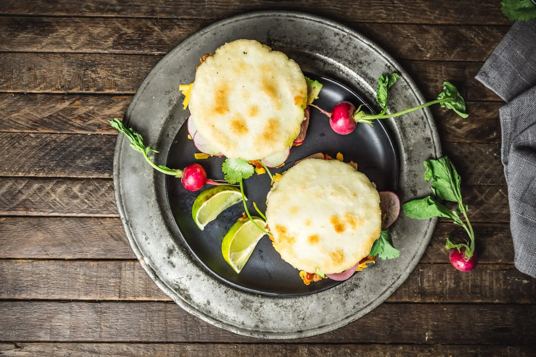 Arepas with Pulled BBQ Chicken, Cheddar, Pickled Onions and Avocado