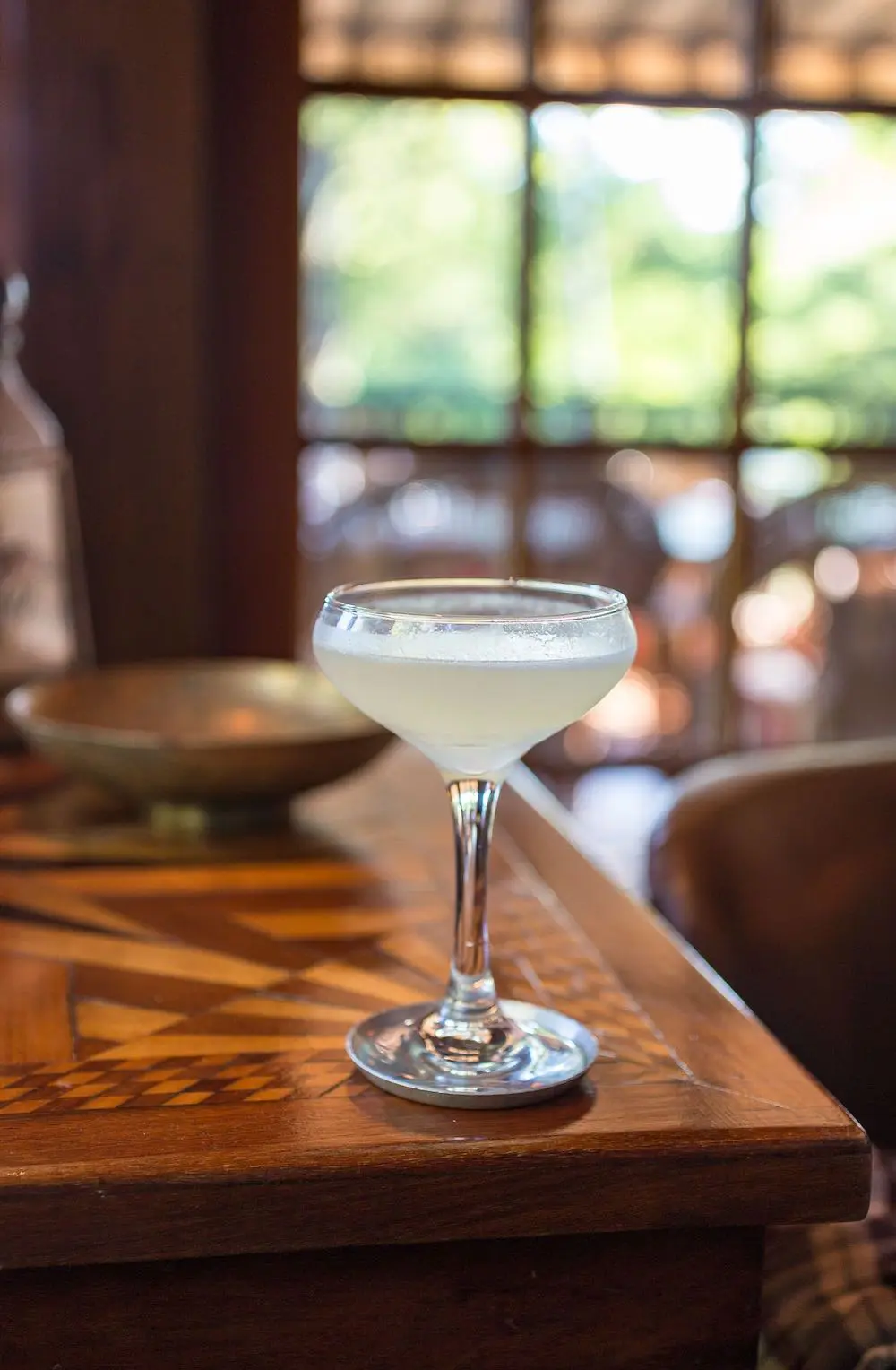 A pale cocktail in a coupe glass