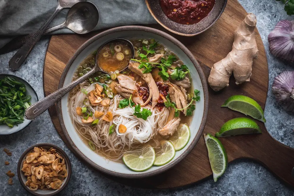 A bowl of chicken soup with noodles