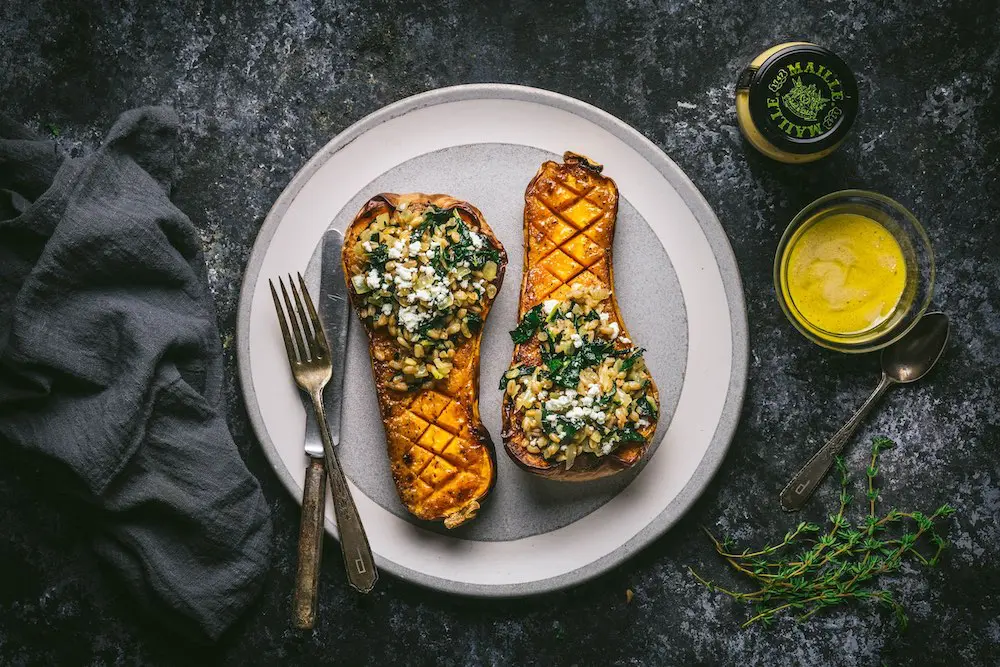 Mustard Glazed Butternut Squash Stuffed with Farro and Winter Greens