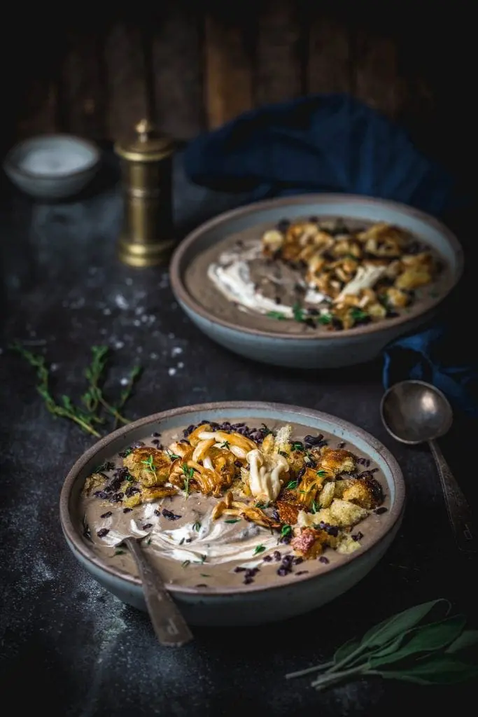 Bowls of brown creamy mushroom soup