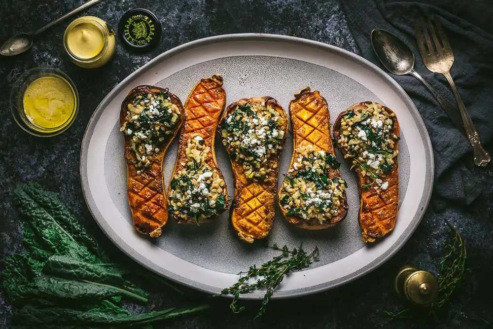 Mustard Glazed Butternut Squash Stuffed with Farro and Winter Greens