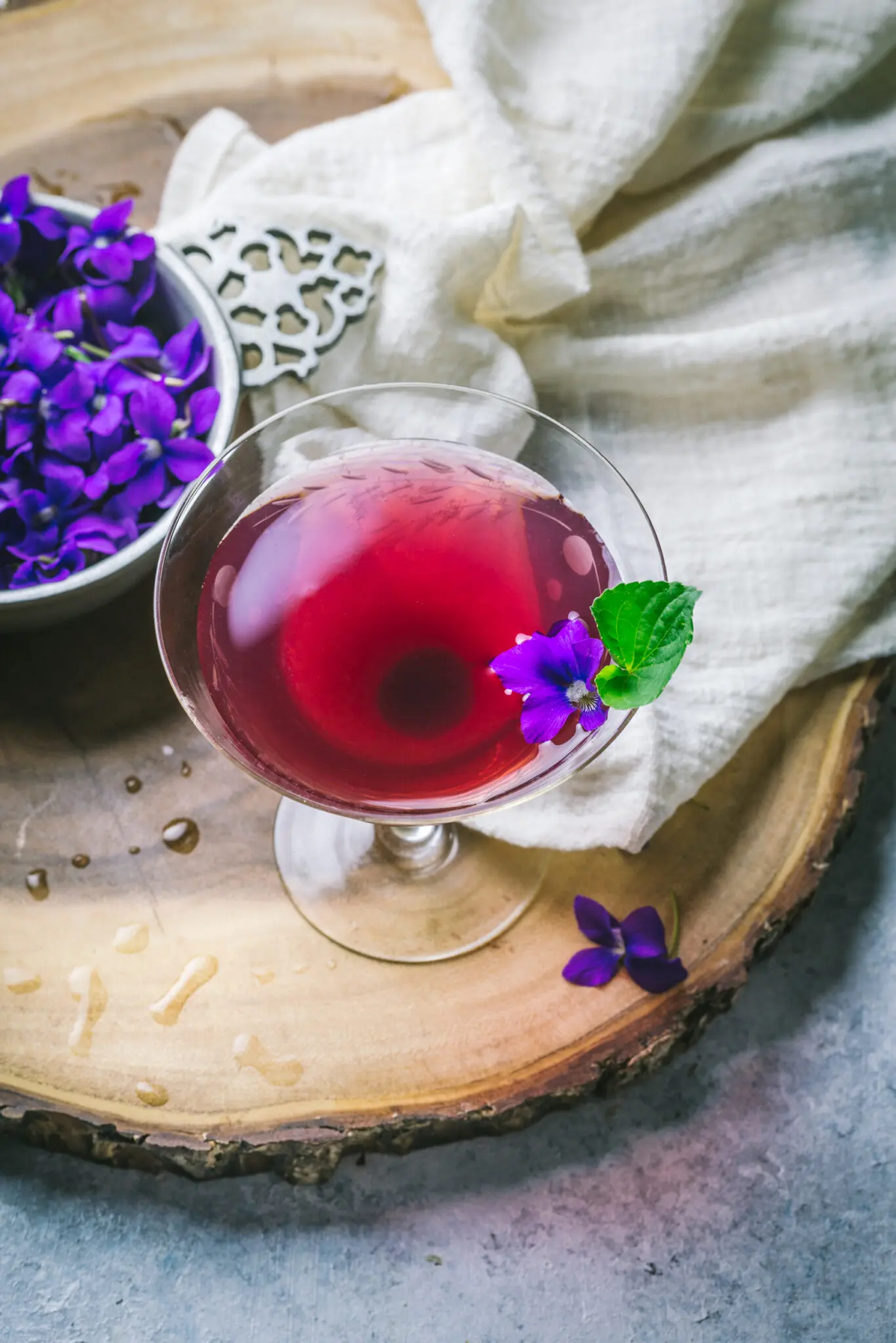 Violet Cocktail with edible flowers