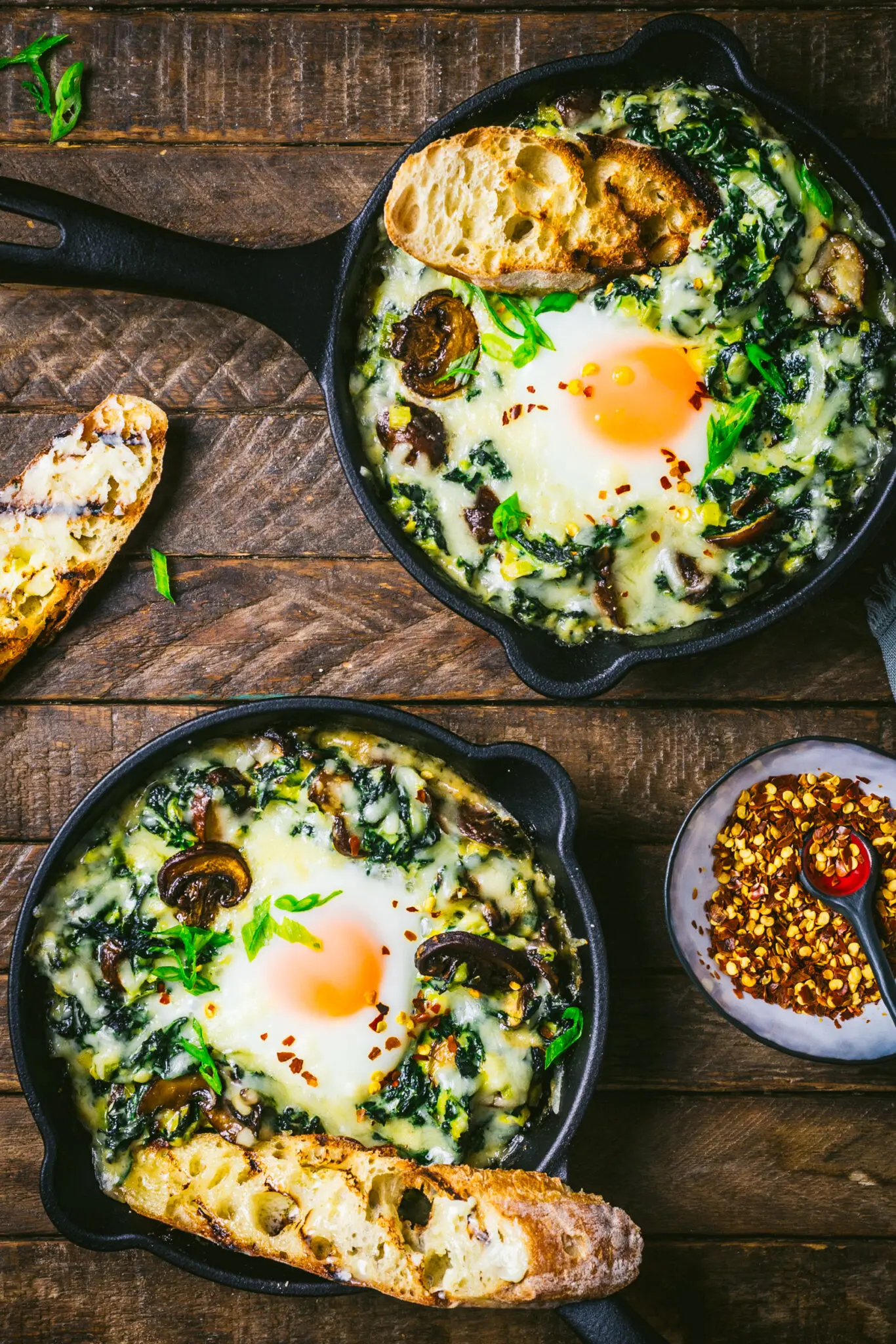 Creamed Kale and Chard with Baked Eggs and Garlic Butter Toasts