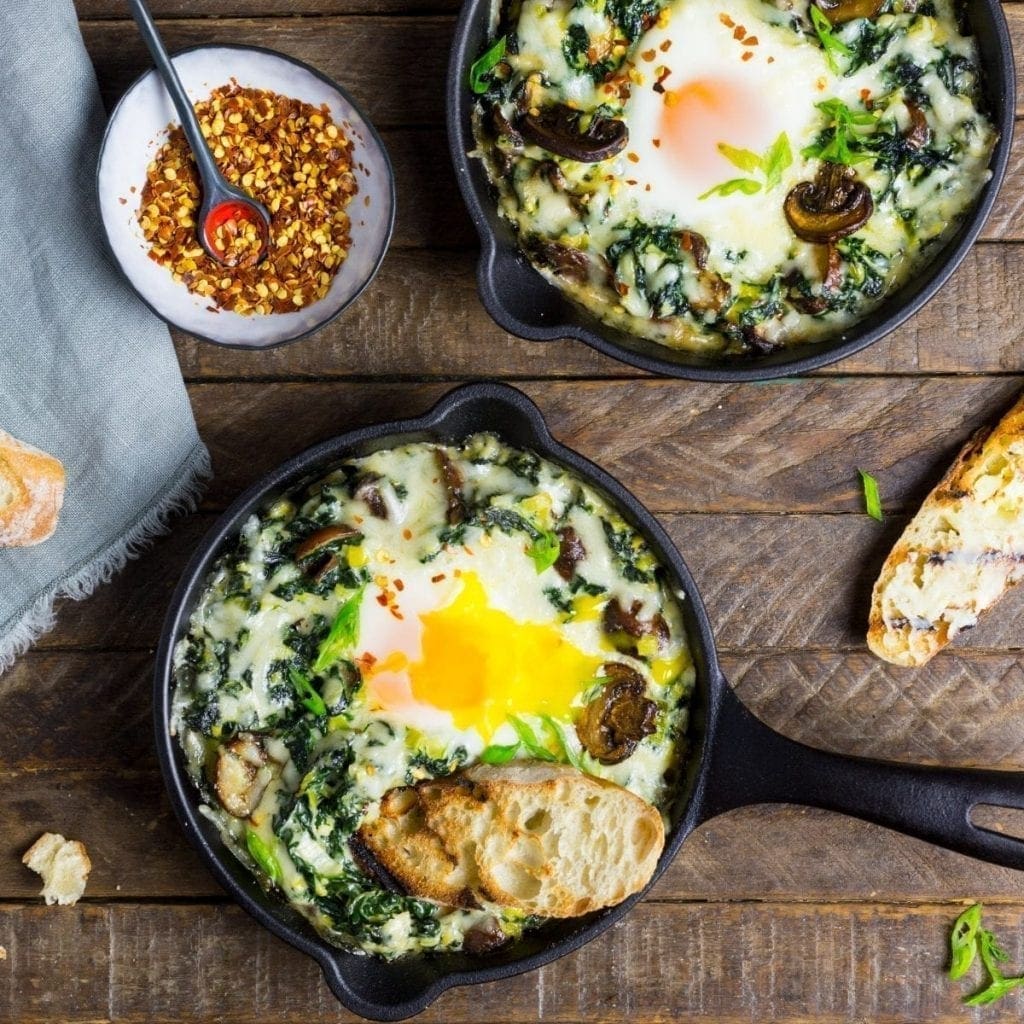 Baked Eggs with Creamy Greens and Garlic Butter Toasts