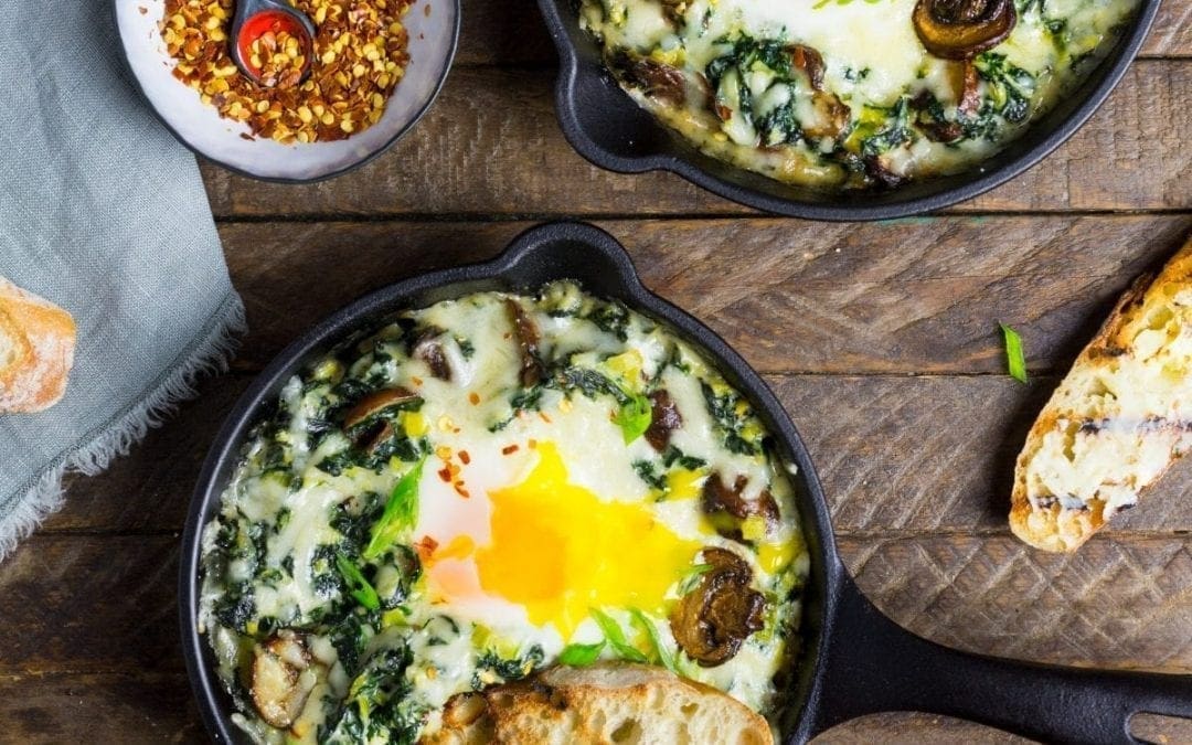 Baked Eggs with Creamy Greens and Garlic Butter Toasts
