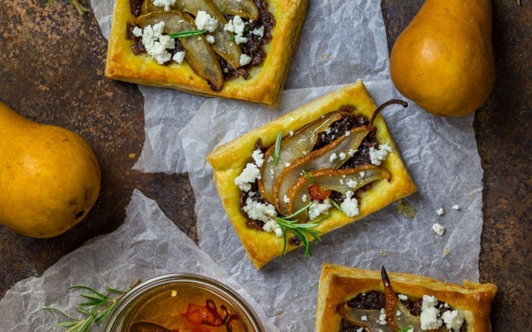 Caramelized Red Onion and Pear Tarts with Goat Cheese and Spicy Honey Drizzle