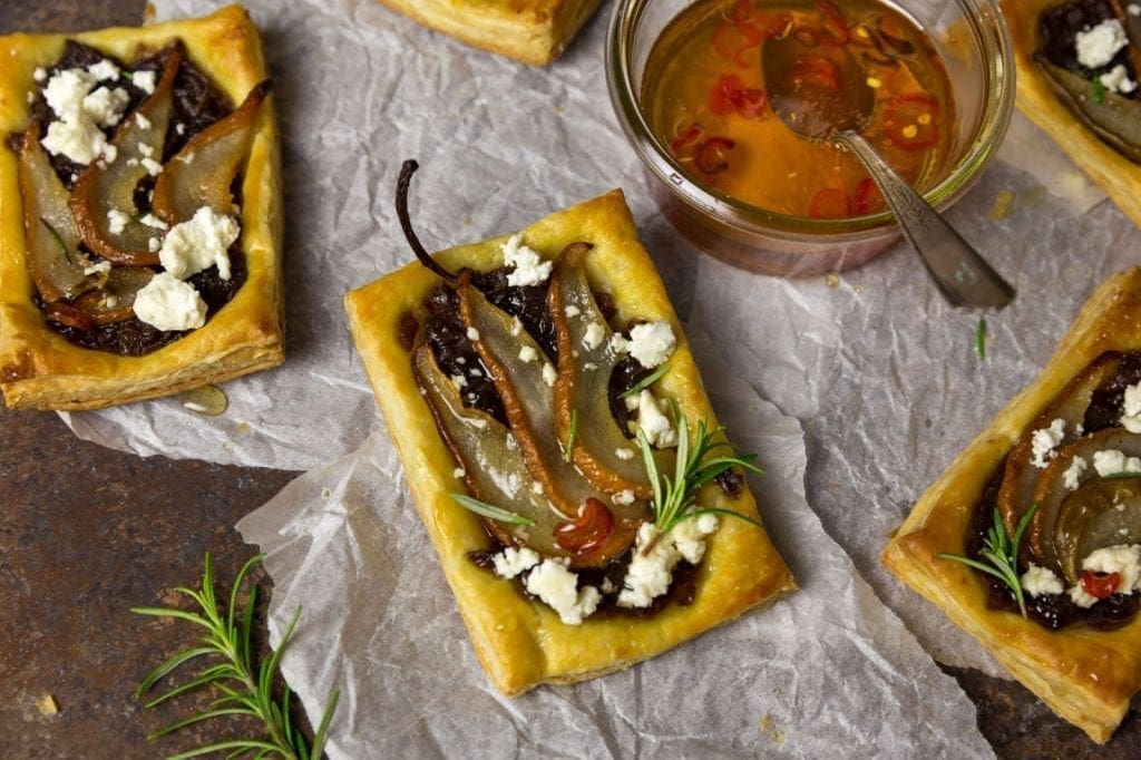 Pear & Caramelized Red Onion Tarts with Goat Cheese and Spicy Honey Drizzle
