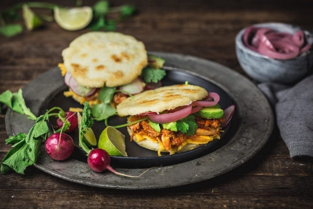 Arepas with Pulled BBQ Chicken, Cheddar, Pickled Onions and Avocado