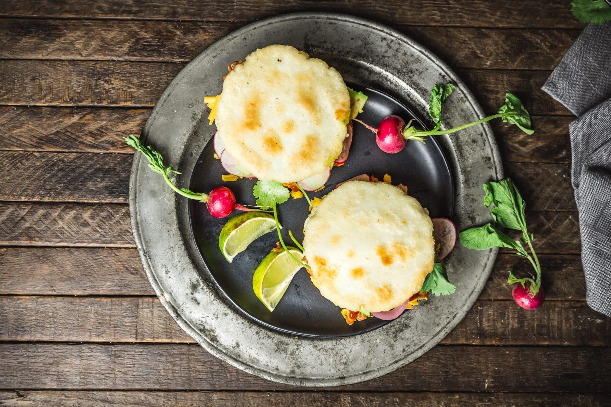 Arepas with Pulled BBQ Chicken, Cheddar, Pickled Onions and Avocado
