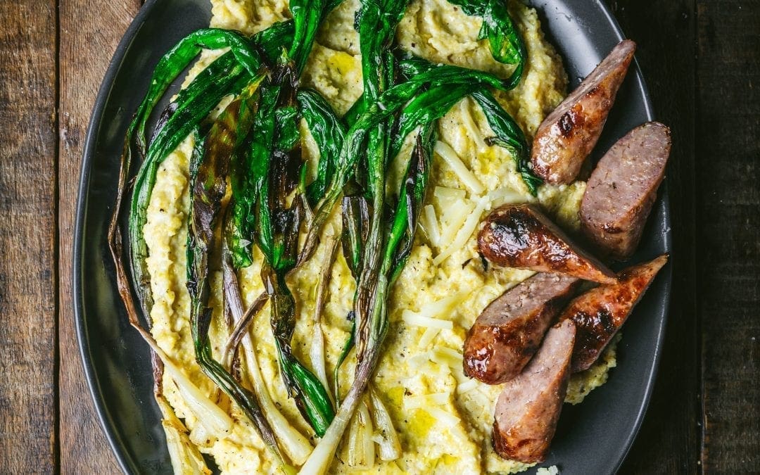 Creamy Cheddar Polenta with Sausage and Charred Ramps