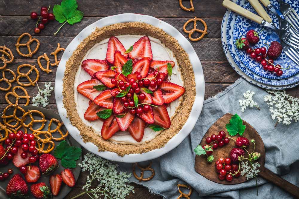 Strawberry Pretzel Pie in a pie dish with scattered pretzels
