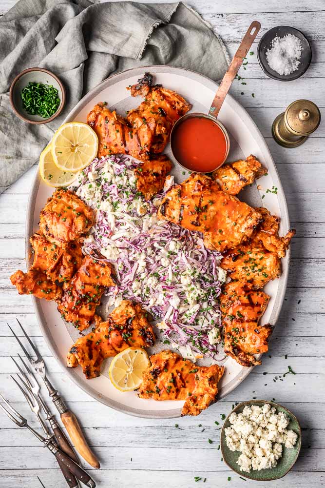 Grilled Buffalo Chicken Thighs with Blue Cheese Slaw