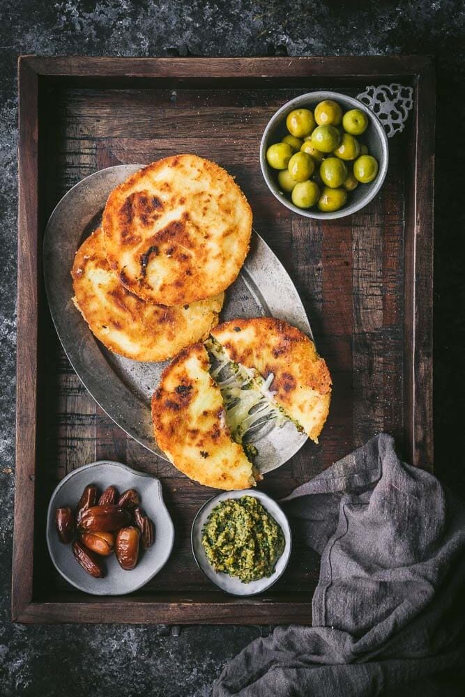 Arepas (corn cakes) with cheese and olives