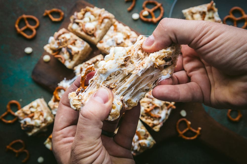 Hands pulling apart a marshmallow square